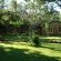 The garden with one of the chalets