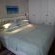 Drievis Main bedroom with Extra large King bed en-suite shower and Sea view