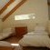 Loft room with 3 single beds.