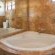 Both Studio Apartments has it's own corner bath/shower