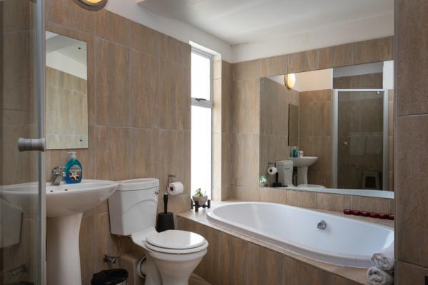 Family bathroom with bath and walk-in shower