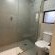 Unit 66A bathroom with bath and shower