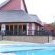 Swimming pool with restaurant at the back