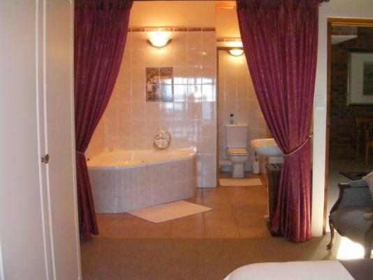 East suite large tub with ocean views