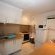 WHITE SELF CATERING APARTMENT KITCHEN