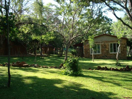 The garden with one of the chalets