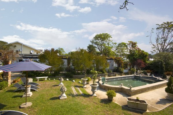 umbrella and pool loungers at pool