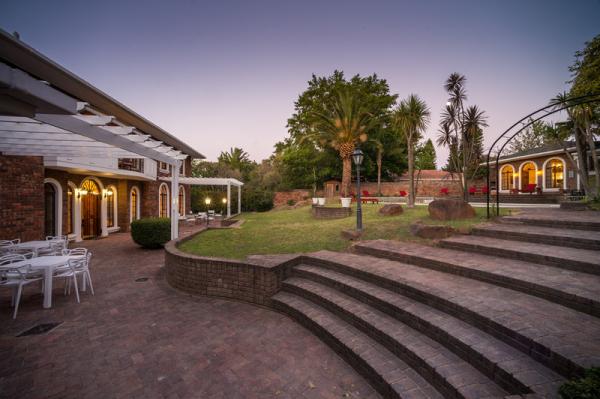 The Main House and Cottage with pool between