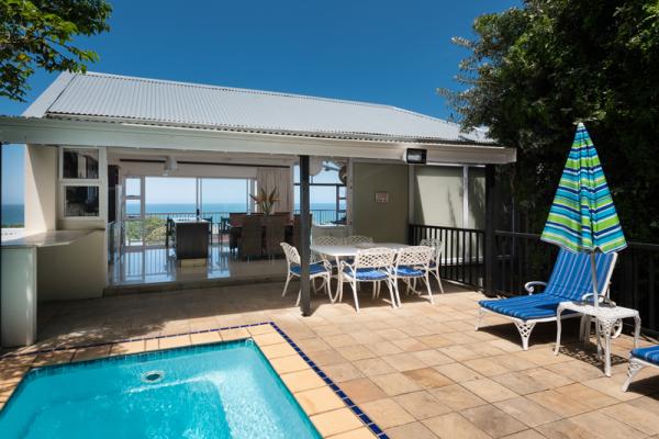 Main photo: Terrace & Pool with view to Ocean