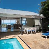 Main photo: Terrace & Pool with view to Ocean