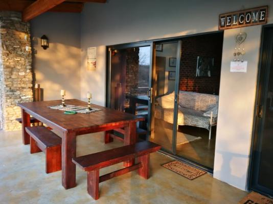 Veranda with view into garden and bush area