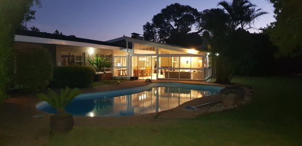 Newly renovated sunroom - evening view from parking area