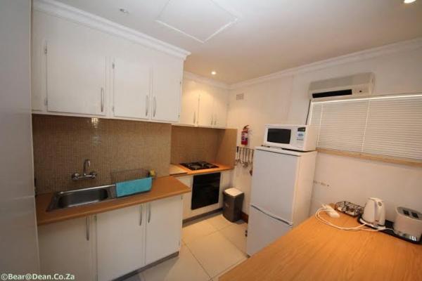 WHITE SELF CATERING APARTMENT KITCHEN