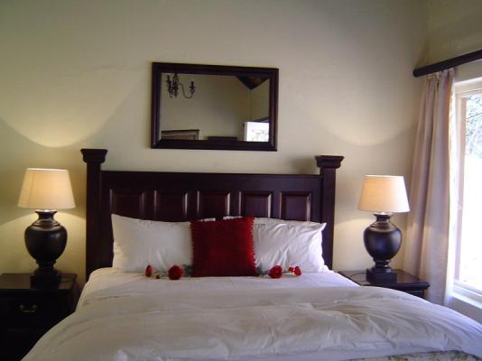 En suite bedroom with queen sized bed