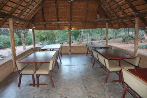 Dining area under big thatched roof