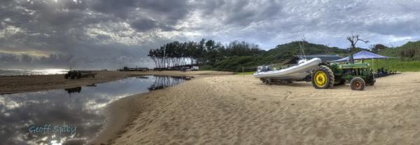 Beach view with one of our dive boats